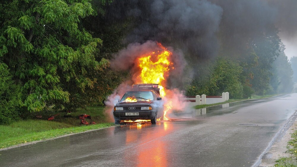 Burning car on the road